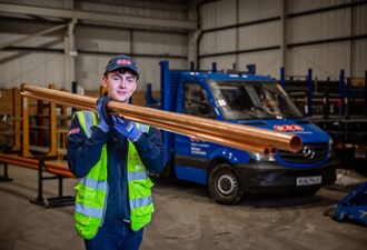 BSS Colleague Carrying Pipes